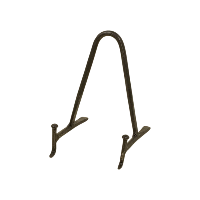 Small Arc Display Stand in black iron with a rounded arch frame, slim supports and splayed feet designed to hold a plate, book or framed decorative object.