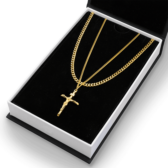 Build Your Own Bundle - Gold featuring two layered gold necklaces including a thick curb chain and a delicate chain with a detailed crucifix pendant in a black and white gift box, bold by design.