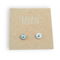 Pair of silver earrings with turquoise stones on a 'BAIZZAR' branded card.