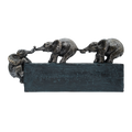 Bronze sculpture of three elephants on a black base