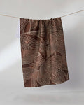 Geometry Pearl Botanical Tea Towel — brown Geoweave™ kitchen towel with white dotted botanical print, 18x30 inches, made from post-consumer recycled materials