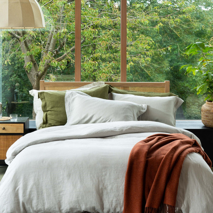 Light Grey French Linen Duvet Cover styled in a bedroom | Soak and Sleep