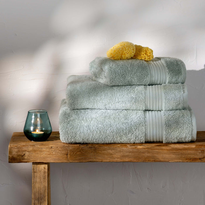 Mineral Blue Egyptian Cotton Hand Towel styled in a bedroom | Soak and Sleep