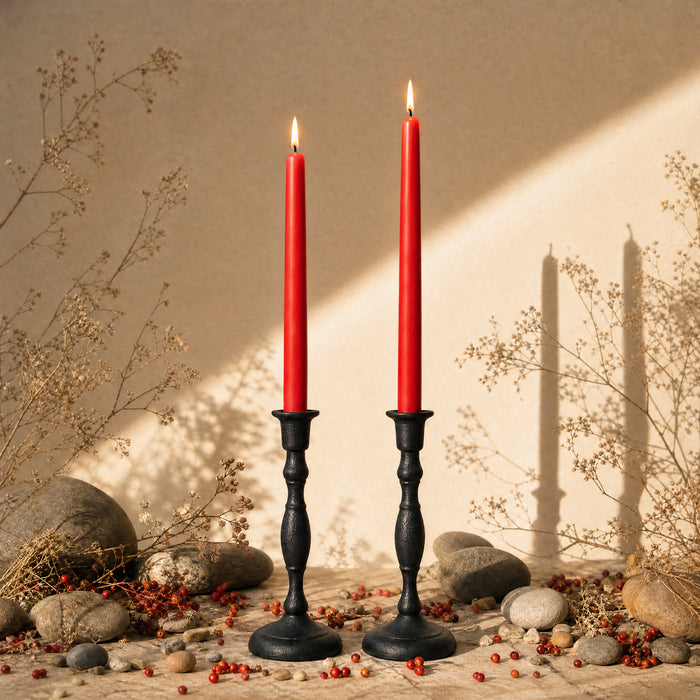 red beeswax taper candles in cast iron candlestick holders bluecorn
