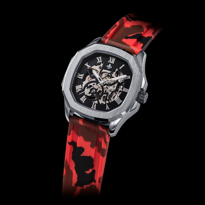 Red Camo Strap With Silver Buckle men's luxury watch featuring a bold red camouflage silicone strap and a silver-tone octagonal case with a skeleton dial and Roman numeral markers.