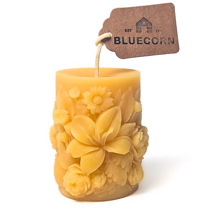 Raw Sculpted Floral Design Beeswax Pillar Candle with white background
