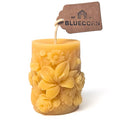 Raw Sculpted Floral Design Beeswax Pillar Candle with white background