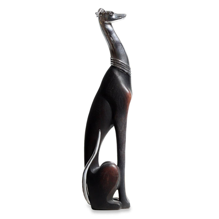 Black and brown dog figurine on a white background