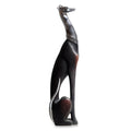 Black and brown dog figurine on a white background