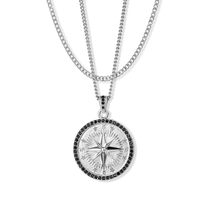 The Compass Essentials Bundle - Silver features a bold silver compass pendant with black cubic zirconia accents on a matching silver chain necklace, designed for men's jewelry.
