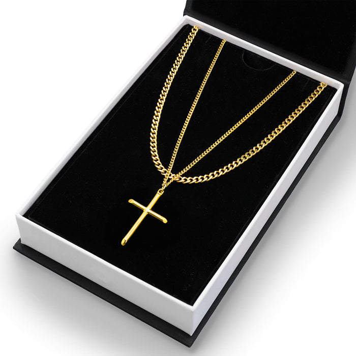 The Cross Essentials Bundle - Gold featuring two gold-tone men's jewelry chains, one with a sleek cross pendant, presented in a luxury black and white gift box.