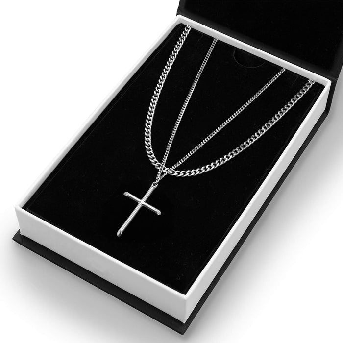 The Cross Essentials Bundle - Silver featuring layered men's jewelry with a polished silver cross pendant and matching silver chains presented in a sleek black and white box, bold by design.