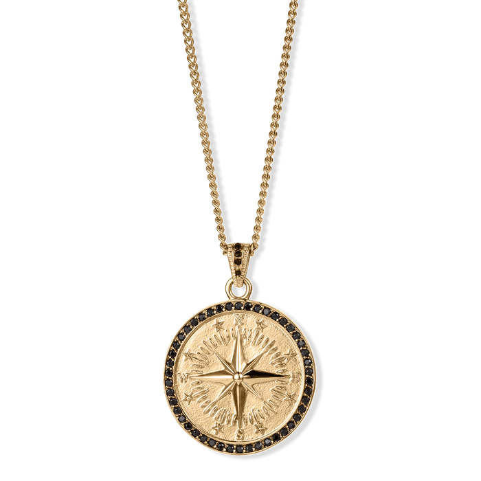 The Compass Essentials Bundle - Gold pendant featuring a detailed compass design in polished gold with a black stone-set border, hanging from a gold chain necklace, bold by design.