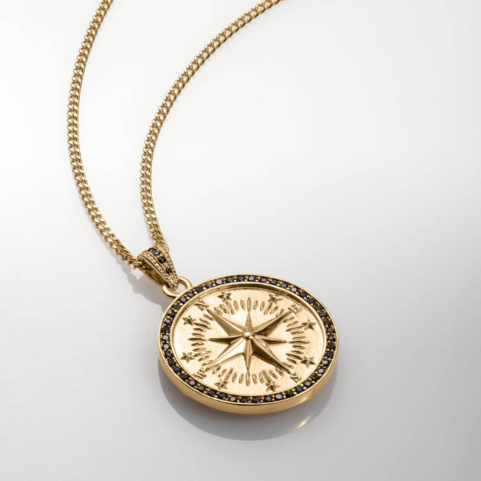 The Compass Essentials Bundle - Gold pendant necklace with a round compass design in polished gold and black cubic zirconia accents on a matching gold chain, bold by design.