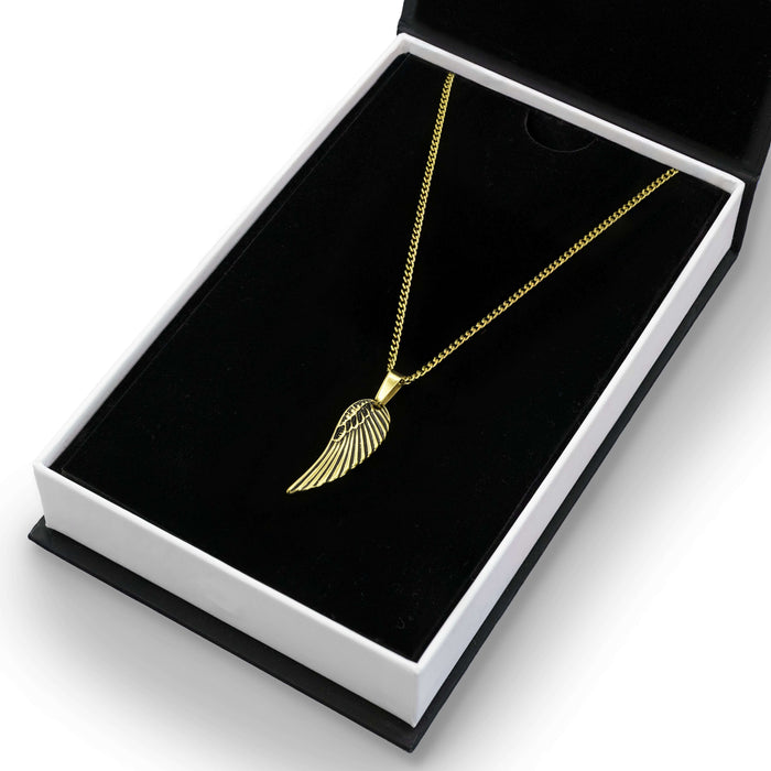 The Gold Wing Pendant - Essentials Collection displayed in a black jewelry box, featuring a sleek, gold-toned wing-shaped pendant on a matching gold chain, designed as men's jewelry, bold by design.