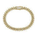 Gold-tone bracelet with interlocking links and a rectangular clasp encrusted with small cubic zirconia stones, shown on a white background.