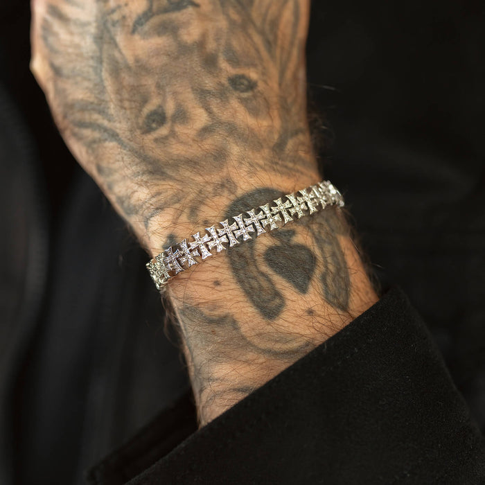 The Iced Creed Bracelet - Silver displayed on a tattooed male wrist, featuring a bold silver chain design with cube-shaped links, perfect for men's jewelry statement pieces.