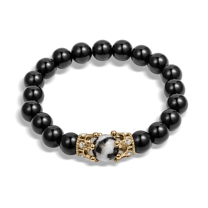 The Royal Obsidian Bracelet featuring polished black beads with a central marbled bead flanked by detailed gold-tone crown accents, designed for men.