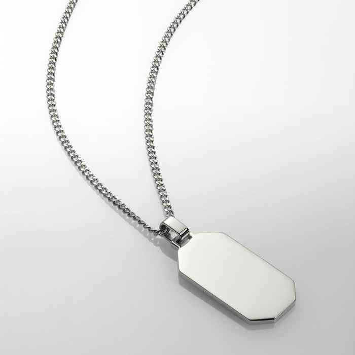The Silver Totem Pendant - Essentials Collection showcasing a sleek, polished silver octagonal pendant on a matching silver chain designed for men, bold by design.