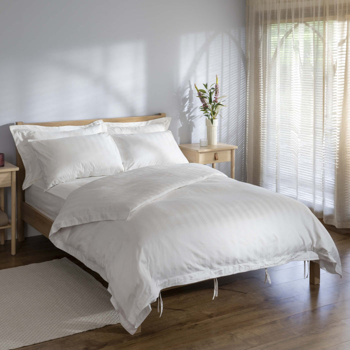White 400 Thread Count Cotton Dobby Stripe Pillowcases styled in a bedroom | Soak and Sleep