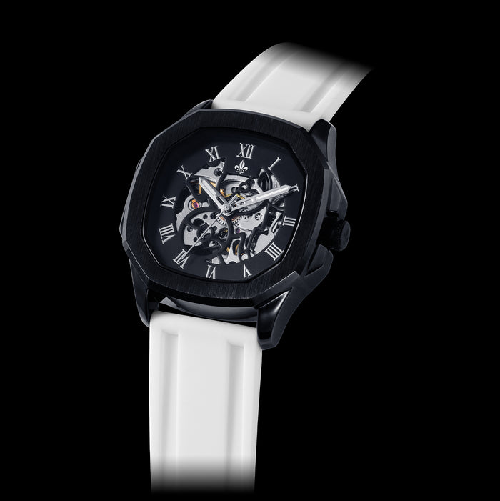 White Silicone Strap With Silver Buckle featuring a bold black case with skeleton dial, Roman numeral markers, and a distinctive masculine design, emphasizing luxury and statement style.